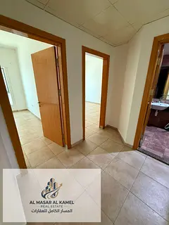 Spacious 2-Bedroom Apartment with Living Room in Al Majaz 2, featuring a direct side lake view. A gr