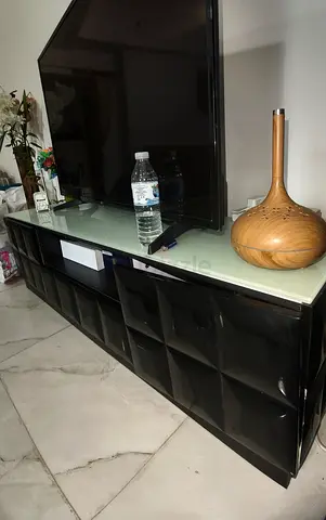 Black low TV cabinet with glass top, good condition