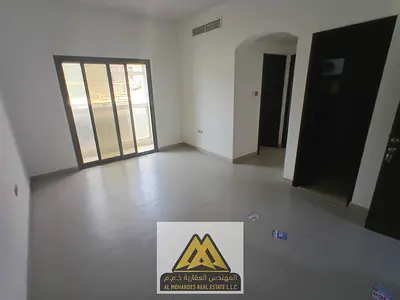 1BR + living room in Al Jurf 3, balcony, bath, closed kitchen, central AC, AED 30K, 6 payments. Nea