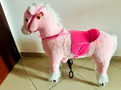 Pink Plush Ride-On Horse Toy with Wheels and Handle for Kids