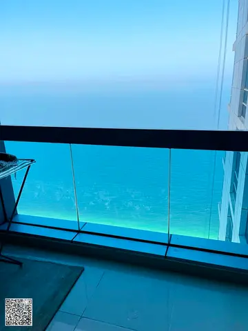 For sale: Two-bedroom apartment with a living room and direct sea view in Corniche Residence – Ajman | High floor | 1,900 sq ft