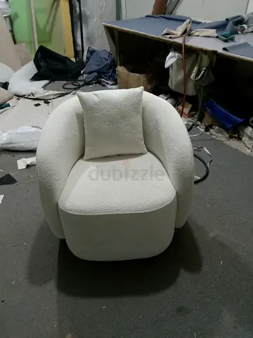 White boucle rounded armchair with cushion
