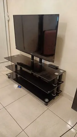 Tv with Black glass TV stand with shelves - 3-tier, sturdy modern unit