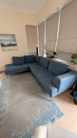 L-shaped blue fabric sofa - great condition, left-facing