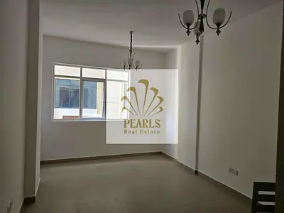 For rent: A unit in Al-Amira Village, Al-Yasmeen area, featuring a room and a living area. It is a