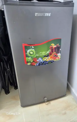 Compact single-door mini fridge in good working condition