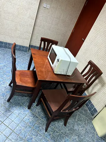 Wooden dining table with 4 chairs - good condition