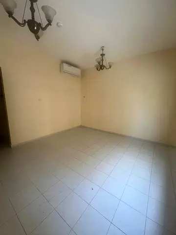 **Studio for rent in Al Qulai'ah for only 19,000 AED, payable in 6 installments; features a separat