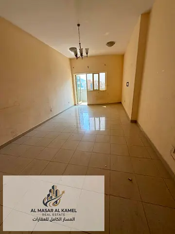 For rent: a spacious 2-bedroom apartment with a living room in Al Majaz 3, Sharjah, in a prime location on Al Ittihad Road, with a maid’s room, laundr