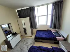 Two bedrooms and a living room for annual rent in Ajman with gym, swimming pool, and parking, with a