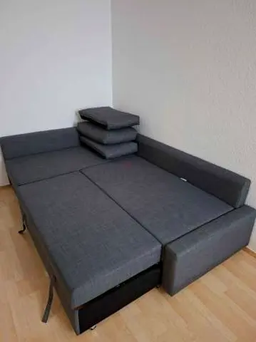 Grey fabric sofa bed with storage