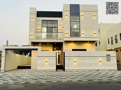 Villa for sale in Ajman | Al Helio 2 area | 5 bedrooms, majlis, 2 living rooms, and maid's room | Freehold | Price includes everything: registration f