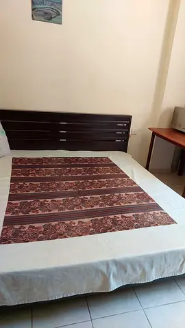 King size wooden bed frame with headboard - and mattress. In  good condition