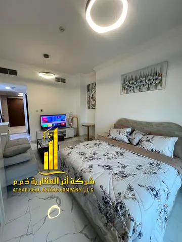 Luxurious, fully furnished studio with brand new, high-end furniture in a prime location with a gym, swimming pool, and private parking.