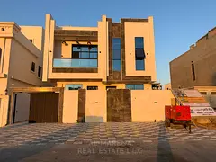 Villa for sale in Ajman | Al Helio 2 area | 5 bedrooms, majlis, living room, maid's room, and roof t