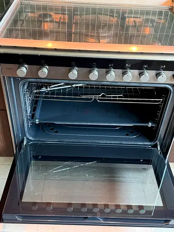 Used freestanding gas oven with grill and multiple racks