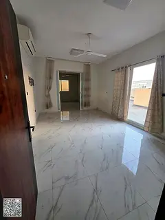 2-bedroom apartment with a living room for annual rent in Ajman, featuring a rooftop gym, swimming p