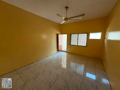 Two-bedroom apartment with a living room for annual rent in Al Nuaimiya 2, Ajman. Spacious yard.