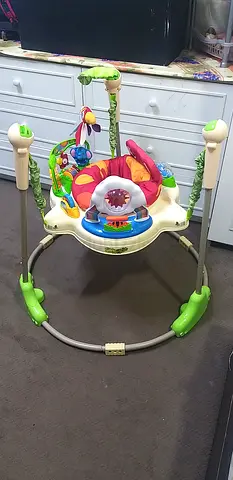 Baby activity jumper with toys and music - good condition