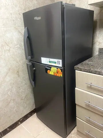 Double-door refrigerator in good working condition as good as new only been used by one person only