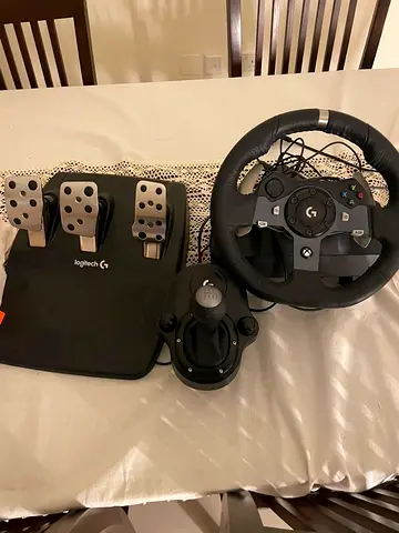 Logitech G920 Driving Force racing wheel set for Xbox/PC, and it includes the 3-pedal unit and the L
