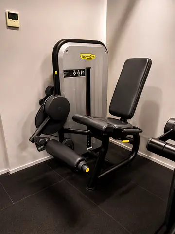 Technogym Seated Leg Extension / Leg Curl Machine - Good Condition