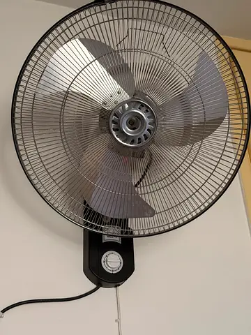 Wall-mounted electric fan - good condition , light usage