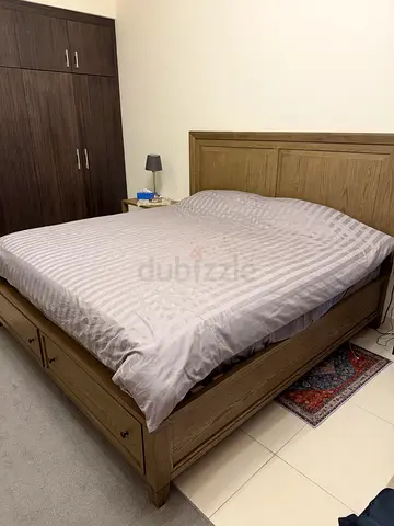 Solid Wood King Size Bed Frame with Storage. Almost new (less than 6 months old) with matress