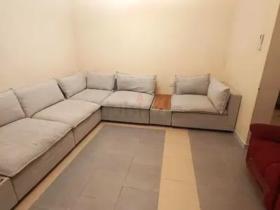 Light grey L-shaped corner sofa set with matching tables