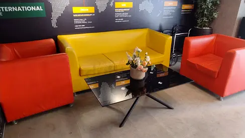 Three-seater yellow sofa with two red armchairs and black glass coffee table - set
