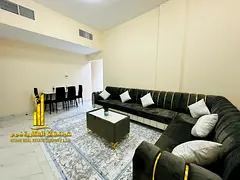 Luxury apartment, second occupancy, two bedrooms, living room, and balcony. Ajman Corniche. Fully fu