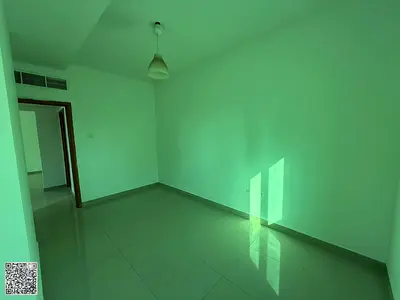 **Two-Bedroom Apartment and Living Room for Annual Rent in Al Rashidiya, with Spacious Areas.