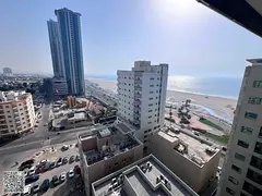 Two bedrooms and a living room for annual rent, first row on Ajman Corniche, with parking.
