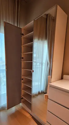 White tall shoe rack with mirror and multiple shelves - good condition