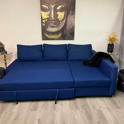 Blue L-shaped Sofa Bed with Storage - Good Condition