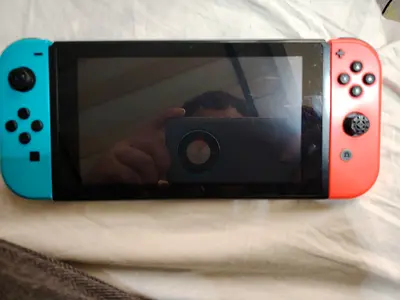 URGENT SALE NINTENDO SWITCH V2 WITH 32GB SD CARD