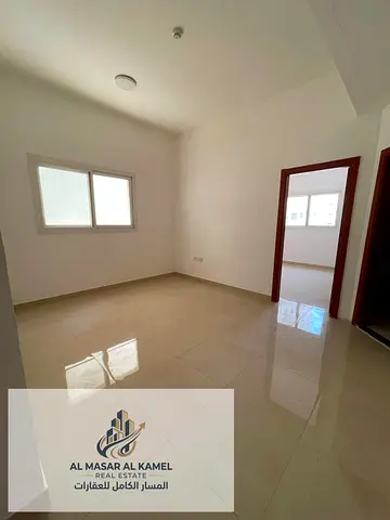One-bedroom apartment with a living room for rent in Al Qulaya, Sharjah, in a prime location close to services and transportation, suitable for famili