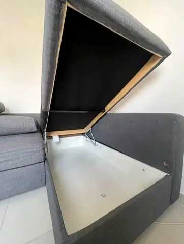 Grey L-shaped sofa with storage ottoman - good condition