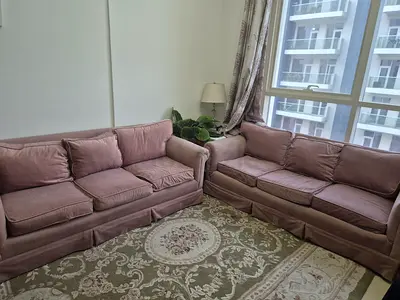 Pair of used 3-seater sofas in dusty rose — good condition