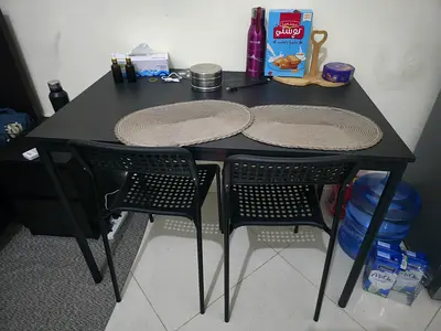 Ikea Compact black dining table with two chairs - good condition