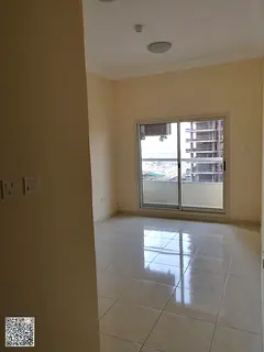 **Apartment for sale in Emirates City consisting of 1 bedroom, a living room, a balcony, and a close