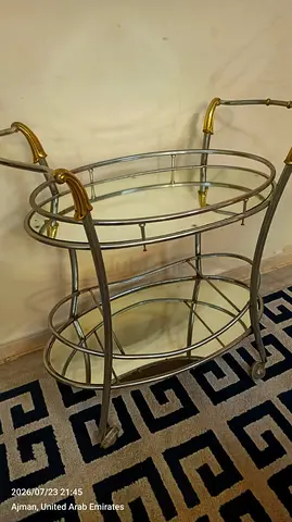 Vintage two-tier metal bar/cart with glass shelves
