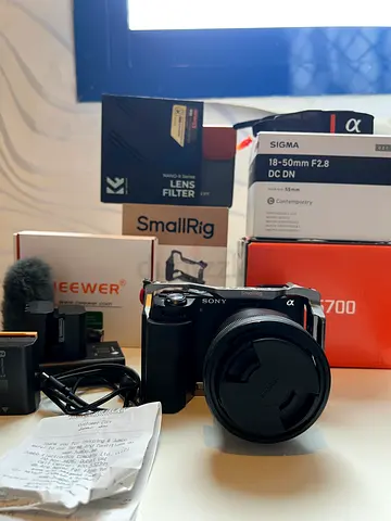 Sony a6700 sigma lens 18-50mm with accessories .
