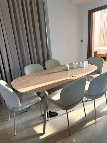 Light Wood Oval Dining Table with 6 Grey Upholstered Chairs