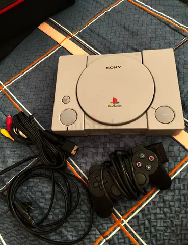 Original Sony PlayStation PS1 console with controllers and AV cables - Good condition
