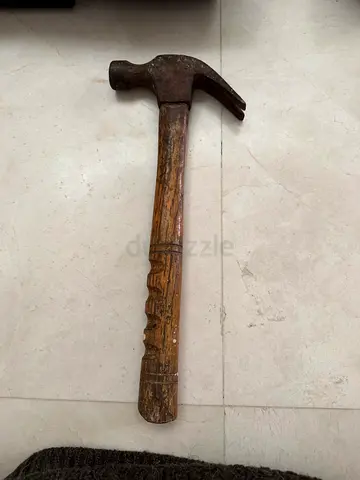 Used claw hammer with wooden handle - sturdy, vintage
