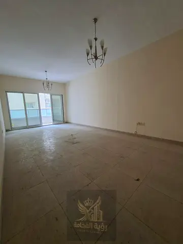 Two-bedroom apartment for annual rent in Al Qasimia, Sharjah, featuring central AC, balcony and two bathrooms. Annual rent AED 40,000, AED 2,000 cash