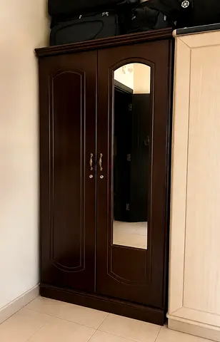 Dark wood two-door wardrobe with mirror