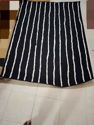Black Rug with White Vertical Stripes - Good Used Condition