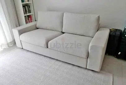 Light grey 2-seater fabric sofa in good condition